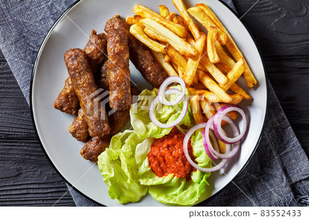 cevapcici with potato fries, lettuce, onion, ajvar 83552433