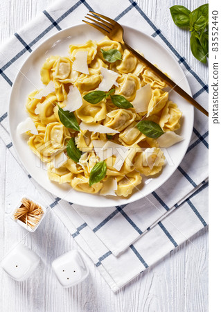tortelloni with cheese filling on a plate tortelloni with cheese filling on a plate 83552440