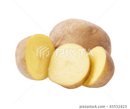 Two potatoes cut in half (slices). Isolated over white background. 83552823