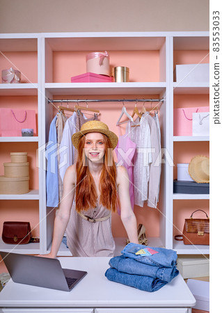 Beautiful female fashion designer stylist use laptop fot consulting customers on office desk 83553033