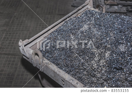 Pile of metal shavings background, industrial iron waste and steel recycle industry 83553155
