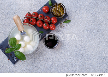 Mozzarella cheese, basil and tomato cherry Mozzarella cheese, basil and tomato cherry 83553943
