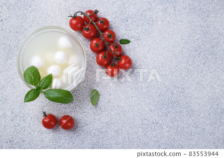 Mozzarella cheese, basil and tomato cherry Mozzarella cheese, basil and tomato cherry 83553944