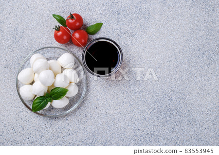Mozzarella cheese, basil and tomato cherry Mozzarella cheese, basil and tomato cherry 83553945