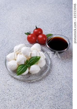 Mozzarella cheese, basil and tomato cherry Mozzarella cheese, basil and tomato cherry 83553946