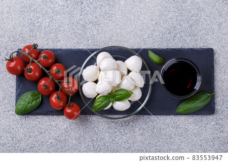 Mozzarella cheese, basil and tomato cherry Mozzarella cheese, basil and tomato cherry 83553947
