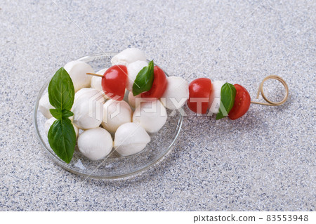 Mozzarella cheese, basil and tomato cherry Mozzarella cheese, basil and tomato cherry 83553948