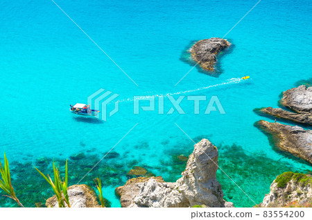 Fishing yacht and rubber boat in Capo Vaticano lagoon, Calabria, Italy Fishing yacht and rubber boat in Capo Vaticano lagoon, Calabria, Italy 83554200