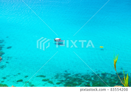 Fishing yacht and rubber boat in Capo Vaticano lagoon, Calabria, Italy Fishing yacht and rubber boat in Capo Vaticano lagoon, Calabria, Italy 83554208