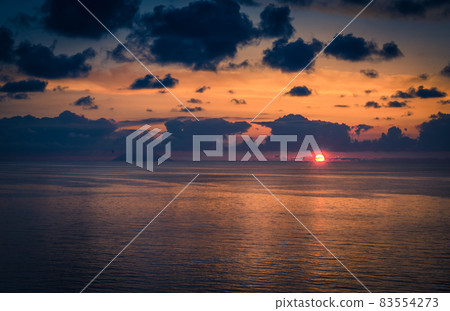 Aerial view of beautiful amazing sea sunset with color dramatic sky Aerial view of beautiful amazing sea sunset with color dramatic sky 83554273