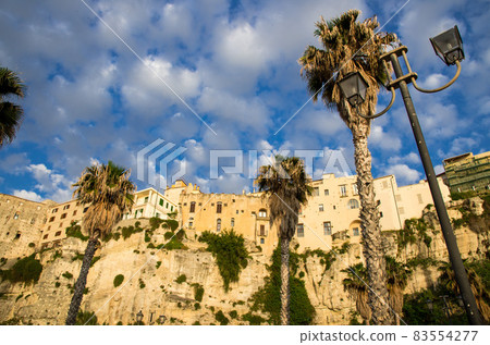 Tropea town colorful stone buildings on top of cliff, Calabria, Italy Tropea town colorful stone buildings on top of cliff, Calabria, Italy 83554277