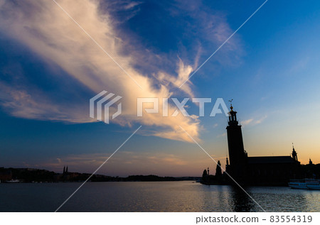 Stockholm City Hall Stadshuset tower at sunset, dusk, Sweden Stockholm City Hall Stadshuset tower at sunset, dusk, Sweden 83554319