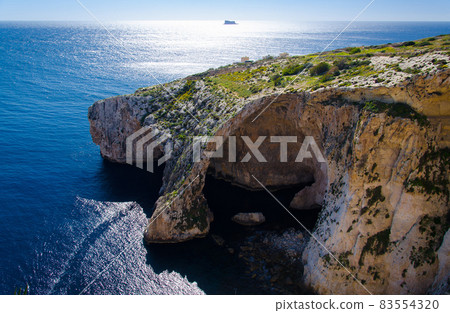 Blue grotto arch on Malta island and Filfla, Mediterranean sea 83554320