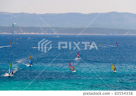 Windsurfers on water of Bol gulf Brac island, Adriatic sea, Croatia 83554338
