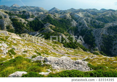 Curvy road to mountain peak Sveti Jure, Biokovo, Dalmatia, Croatia 83554395