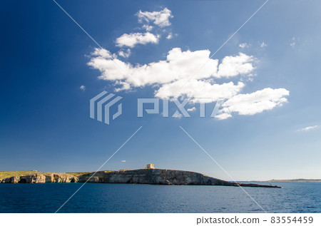 Tower bastioned on island Comino in Mediterranean Sea, Malta 83554459