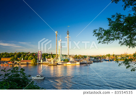 Djurgarden island and Tivoli carousel attractions, Stockholm, Sweden Djurgarden island and Tivoli carousel attractions, Stockholm, Sweden 83554535