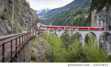 Glacier train on landwasser Viaduct bridge, Switzerland Glacier train on landwasser Viaduct bridge, Switzerland 83554652