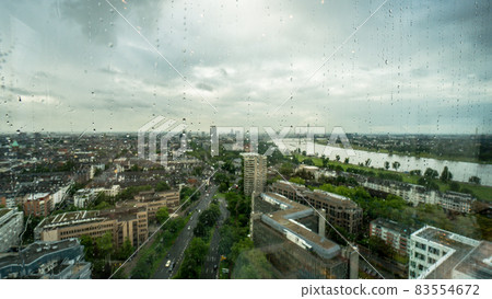 Skyline of Dusseldorf in Germany panorama in rain behind a rainy window 83554672