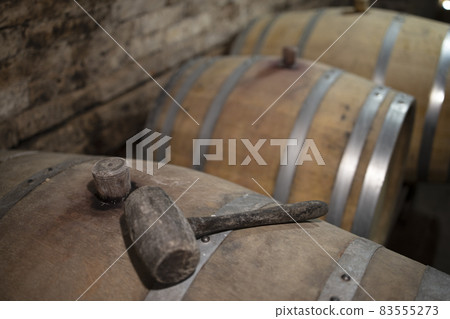 Wooden oak barrels in a winery nearby Batorove Kosihy, Slovakia Wooden oak barrels in a winery nearby Batorove Kosihy, Slovakia 83555273