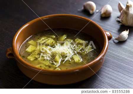 garlic soup with potatoes and marjoram 83555286