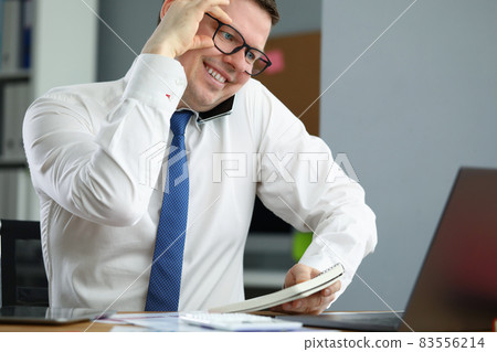 Happy professional employee in cabinet 83556214