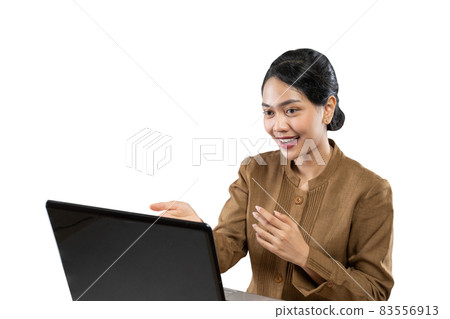 Smiling woman in civil servant uniform using laptop to work Smiling woman in civil servant uniform using laptop to work 83556913