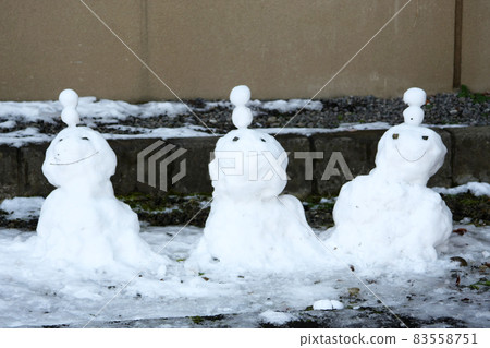 Winter scene with three snowmen 83558751