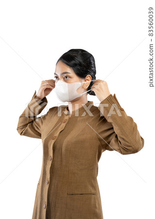 Woman in civil servant uniform wearing mask for health security Woman in civil servant uniform wearing mask for health security 83560039