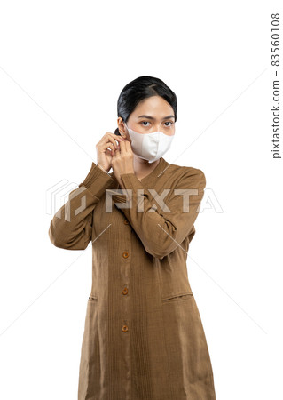 Indonesian women in civil servant uniforms wearing masks Indonesian women in civil servant uniforms wearing masks 83560108