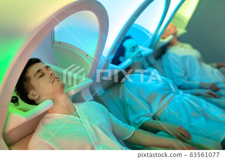 Clients resting in massage chairs for washing hair Clients resting in massage chairs for washing hair 83561077