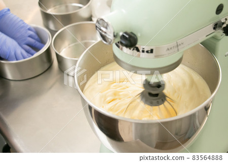 Material image of the process of whipping dough with a candy making stand mixer 83564888