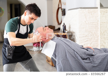 Barber shaving head for male client 83566267