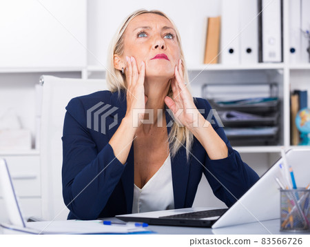 Frustrated mature entrepreneur in office 83566726