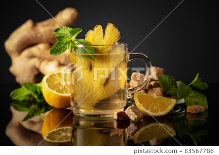 Ginger tea with ingredients on a black background. Ginger tea with ingredients on a black background. 83567786