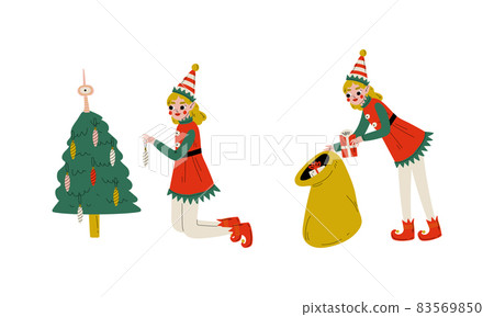 Christmas Elf with Pointy Ears and Hat as Santa Helper Taking Gift Box Out from Sack and Hanging Bauble on Fir Tree Vector Set 83569850
