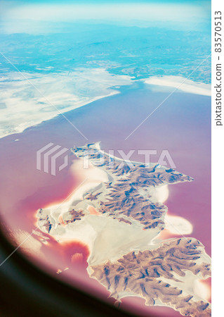 Aerial View Of Lake Urmia From Window Of Plane. Beautiful Lake Urmia Is An Endorheic Salt Lake In Iran. Aerial View Of Jezireye Island-Eshek. West Azerbaijan Province, Iran, Kurdistan Aerial View Of Lake Urmia From Window Of Plane. Beautiful Lake Urmia Is An Endorheic Salt Lake In Iran. Aerial View Of Jezireye Island-Eshek. West Azerbaijan Province, Iran, Kurdistan 83570513