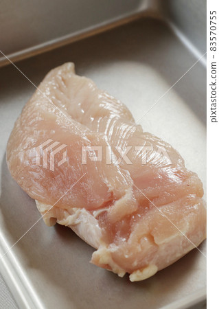 Chicken breast in a cooking bat 83570755