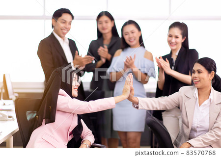 Team asian people giving hands high five together at office,Teamwork successful meeting finishing up Team asian people giving hands high five together at office,Teamwork successful meeting finishing up 83570768