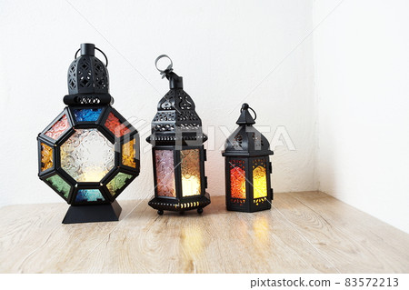 Ramadan Lantern Arabic decoration on wooden table and white wall background 83572213