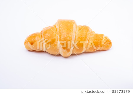 Croissant on a white background. 83573179