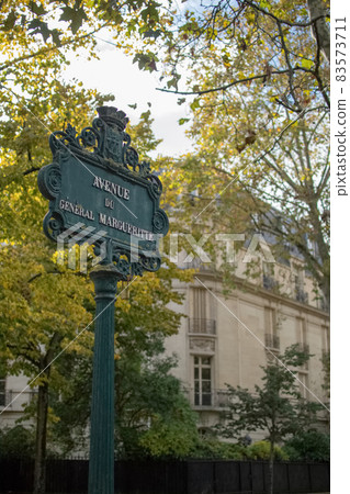 Road sign with street name on the street corner of Paris, France 83573711