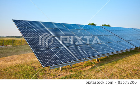 Picture of solar panel modules on a field, selective focus. 83575200