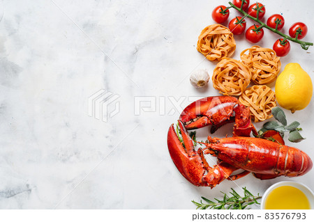 Delicious freshly cooked lobster with black pasta and vegetables Delicious freshly cooked lobster with black pasta and vegetables 83576793