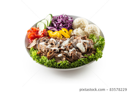 Veal kebab with fresh vegetable, fries and rice isolated on white background 83578229