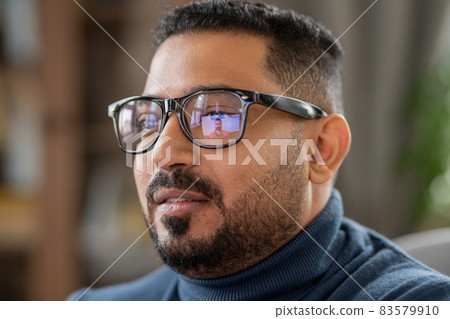 Head of mature man in eyeglasses sitting in front of laptop Head of mature man in eyeglasses sitting in front of laptop 83579910