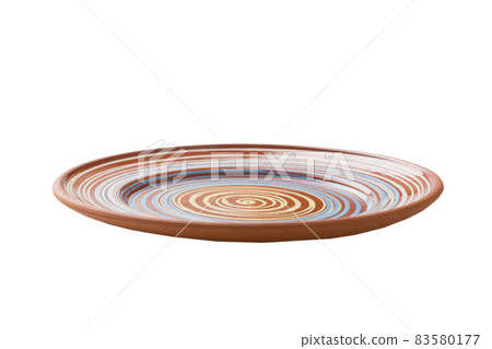 Orange ceramic round plate isolated over white background. perspective view 83580177
