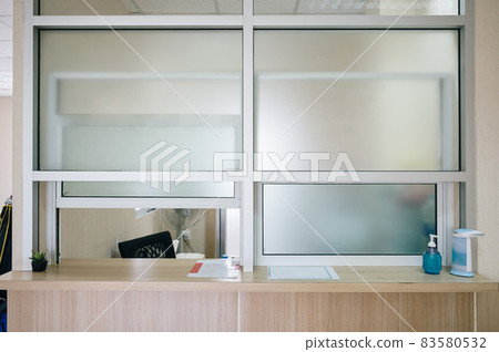Medicine dispensary room with thick window open and counter in hospital 83580532