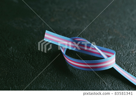ribbon patterned with the transgender pride flag 83581341