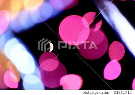Crescent moon floating in bright illuminations Crescent moon floating in bright illuminations 83581713